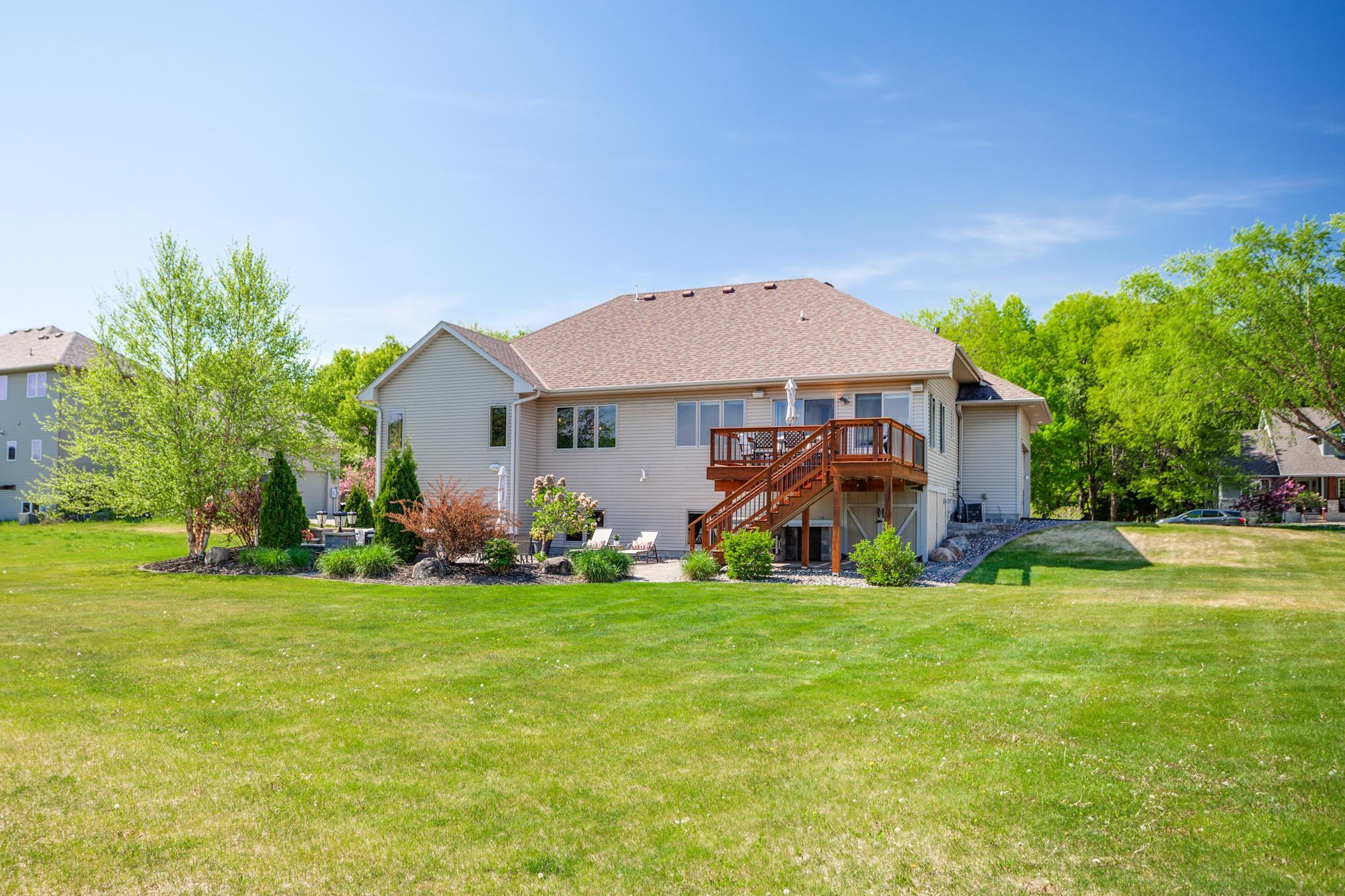 Meticulously landscaped backyard with in-ground sprinkler system