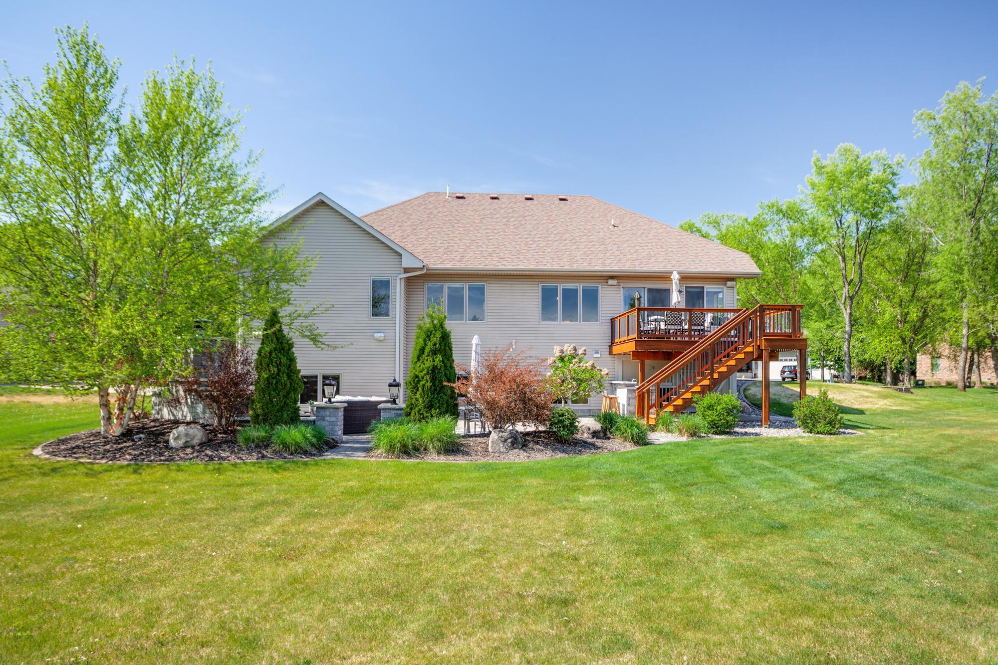 Meticulously landscaped backyard with in-ground sprinkler system
