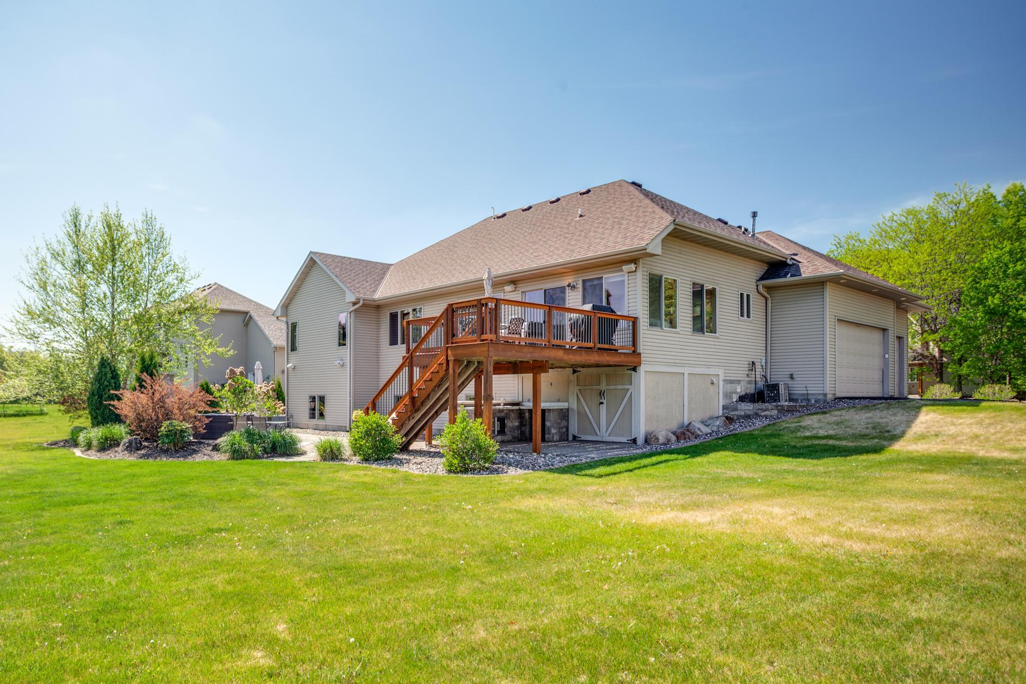 Meticulously landscaped backyard with in-ground sprinkler system