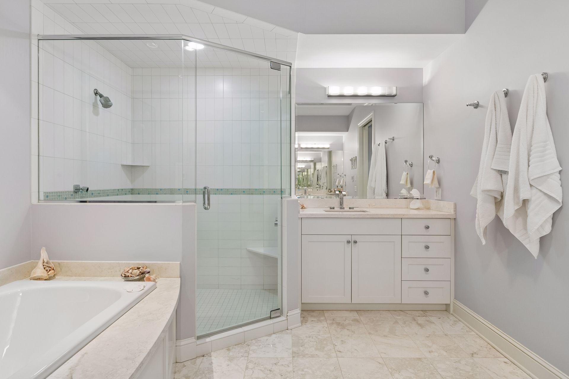 Two vanities, a separate shower and tub
