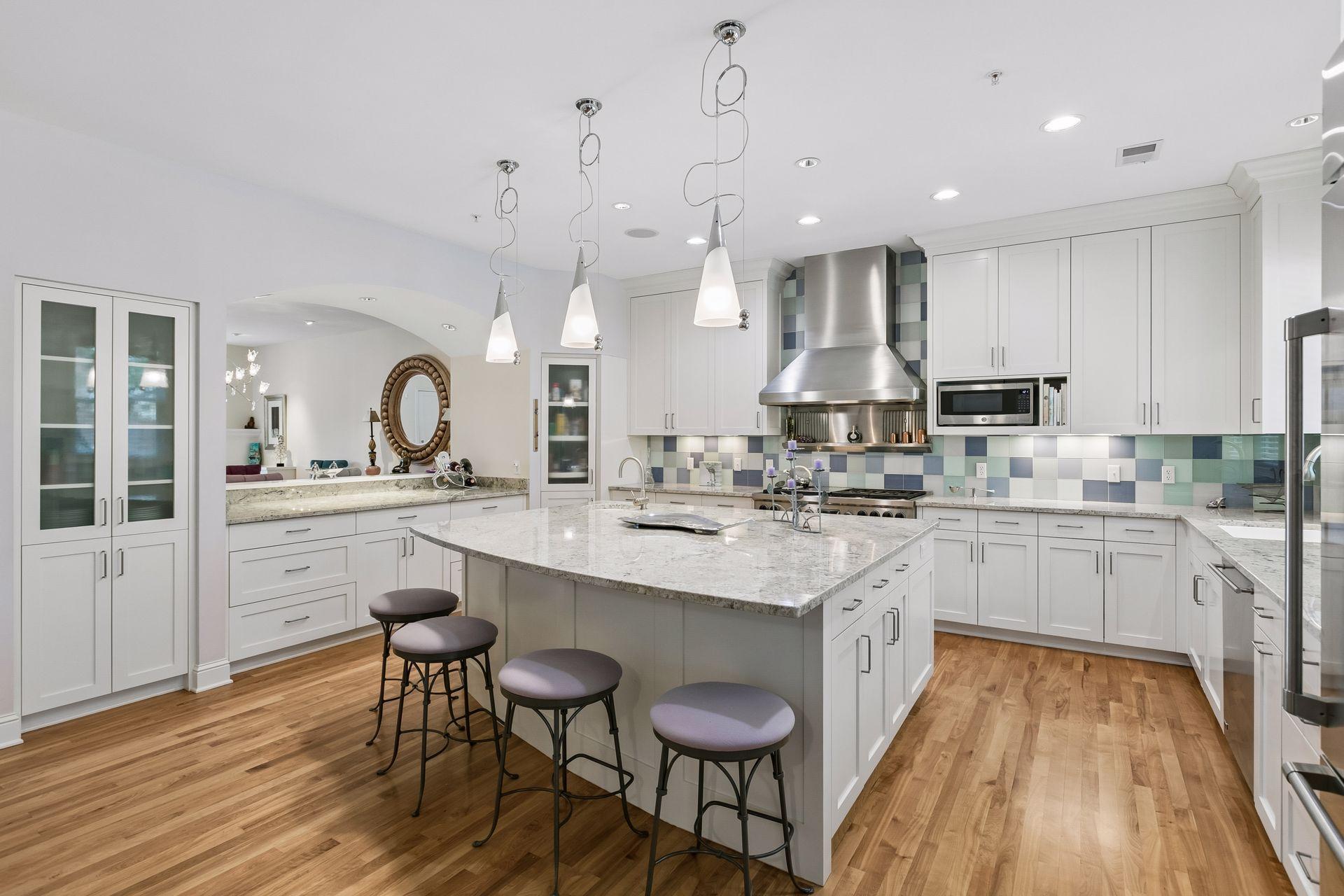 Spacious kitchen with large center island and extensive cabinetry