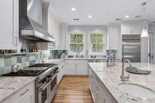 A Chef's dream kitchen which includes a Wolf range