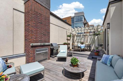 Rooftop deck complete with a gas fireplace and additional grill