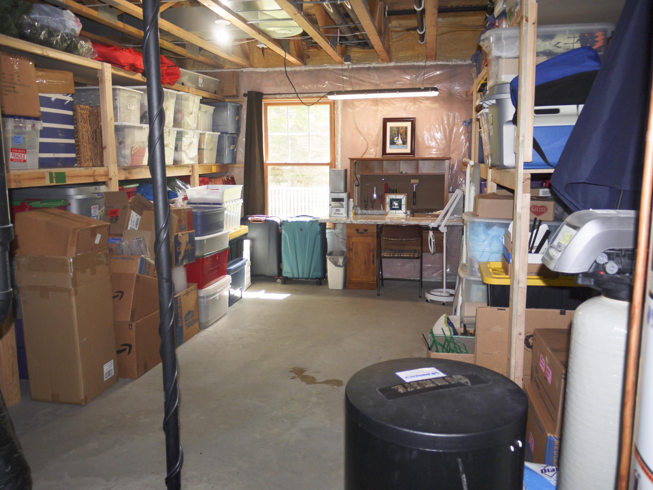 Lower level storage room - great space for shop or hobby room.jpg