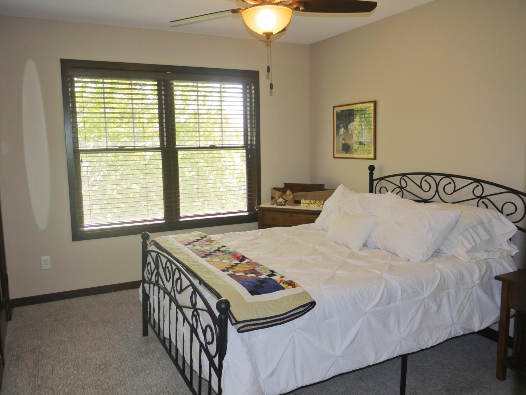 Upper level second bedroom with south facing windows overlooking rear yard.jpg