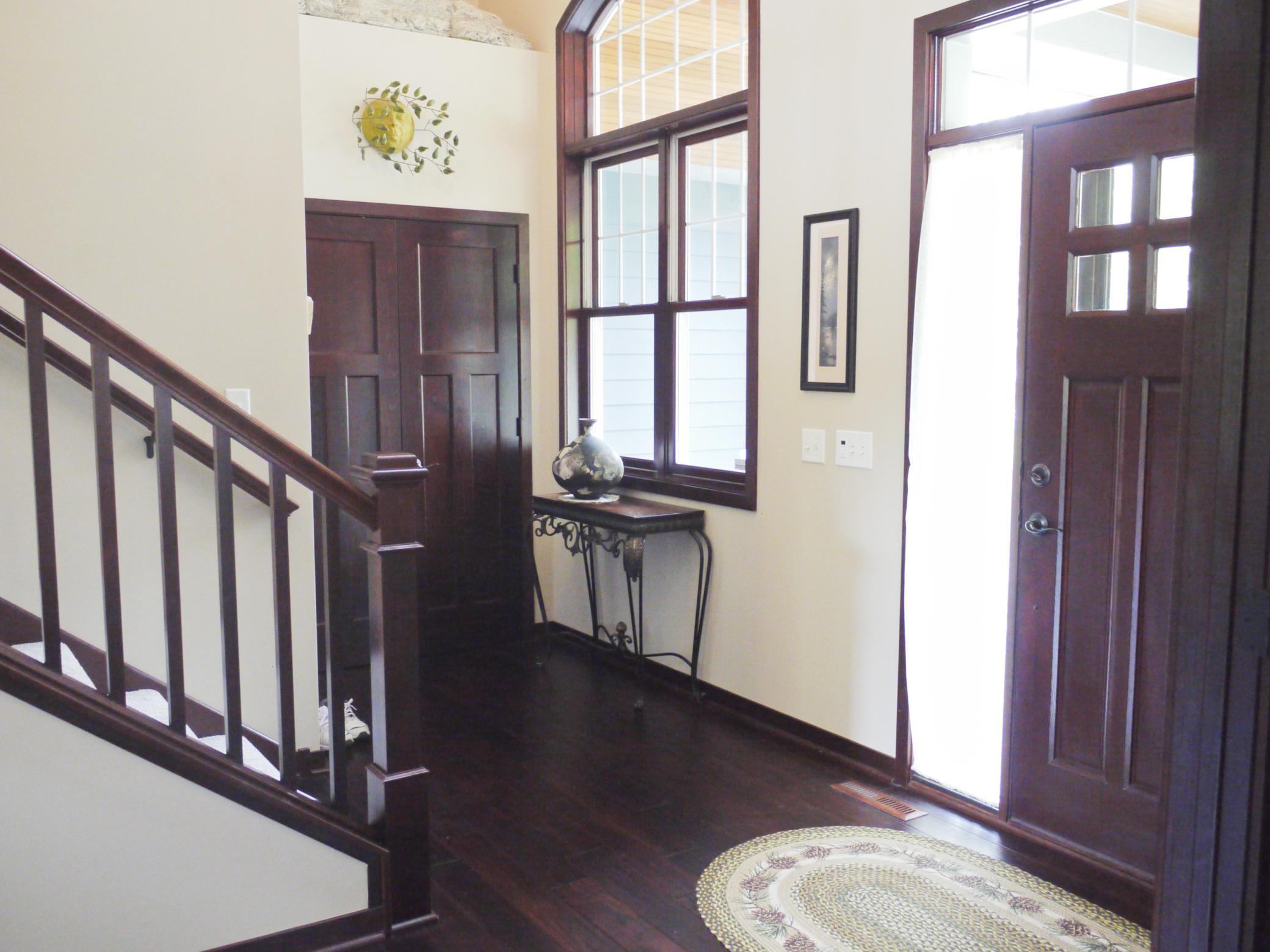 Cross view of foyer showing entry closet and stairs to upper level.jpg