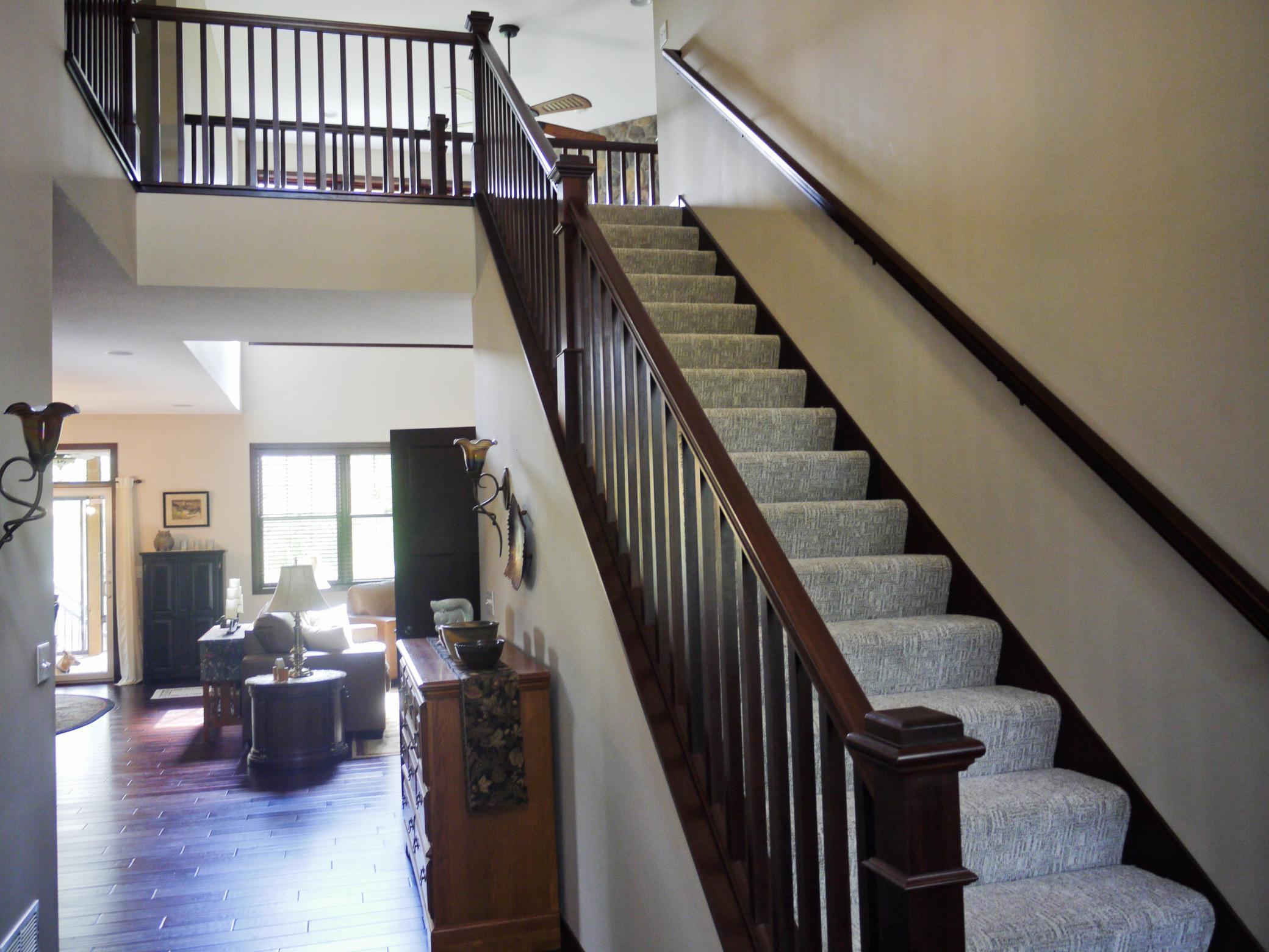 View from foyer to great room area and upper level loft and bedrooms.jpg