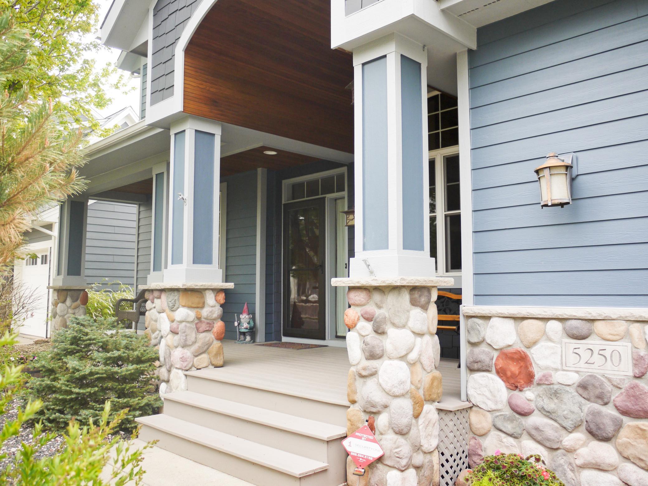 Steps leading to front porch area with ample space for porch furniture.jpg