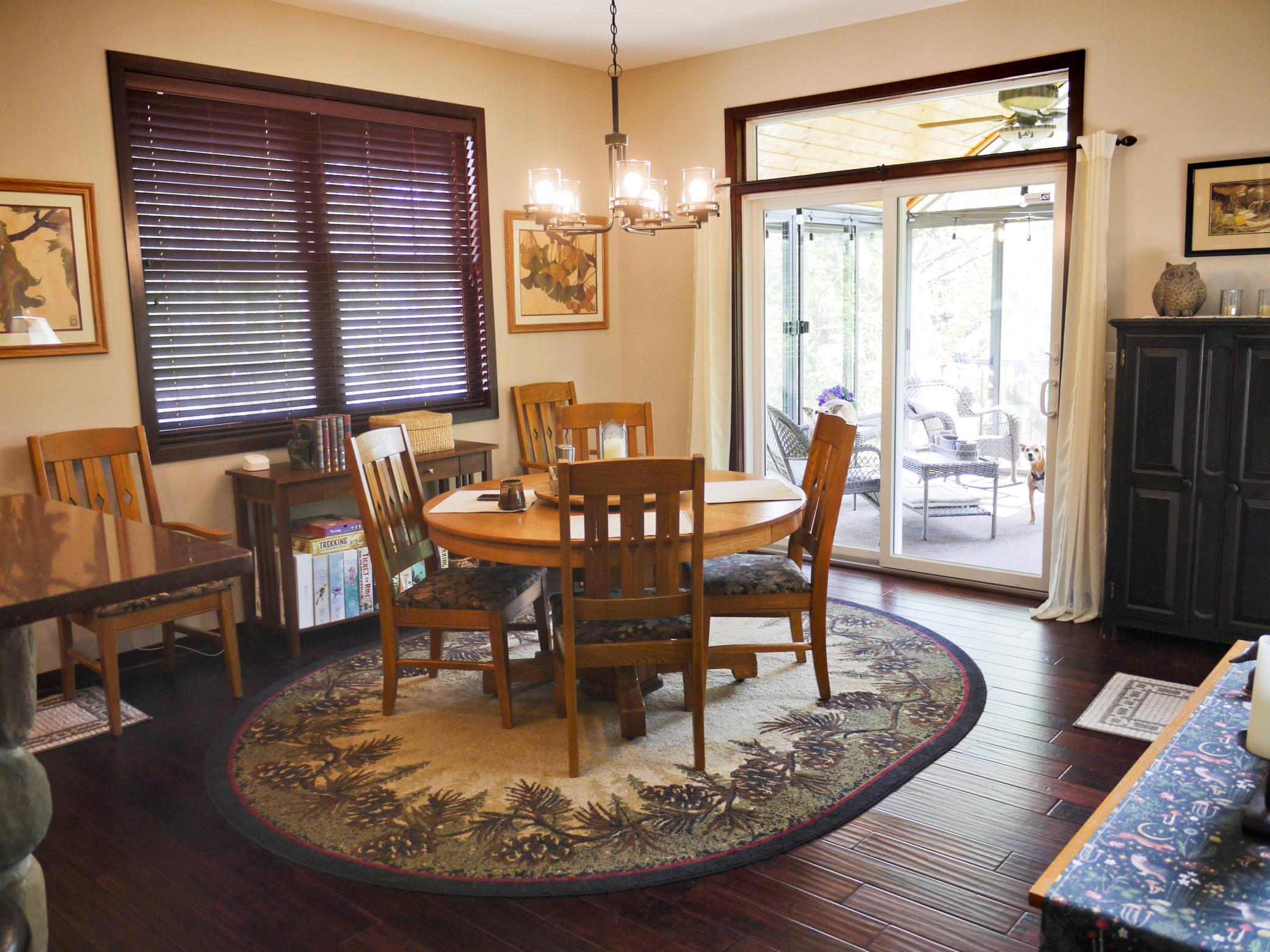 Dining area adjacent to kitchen and great room with 3 season porch access.jpg