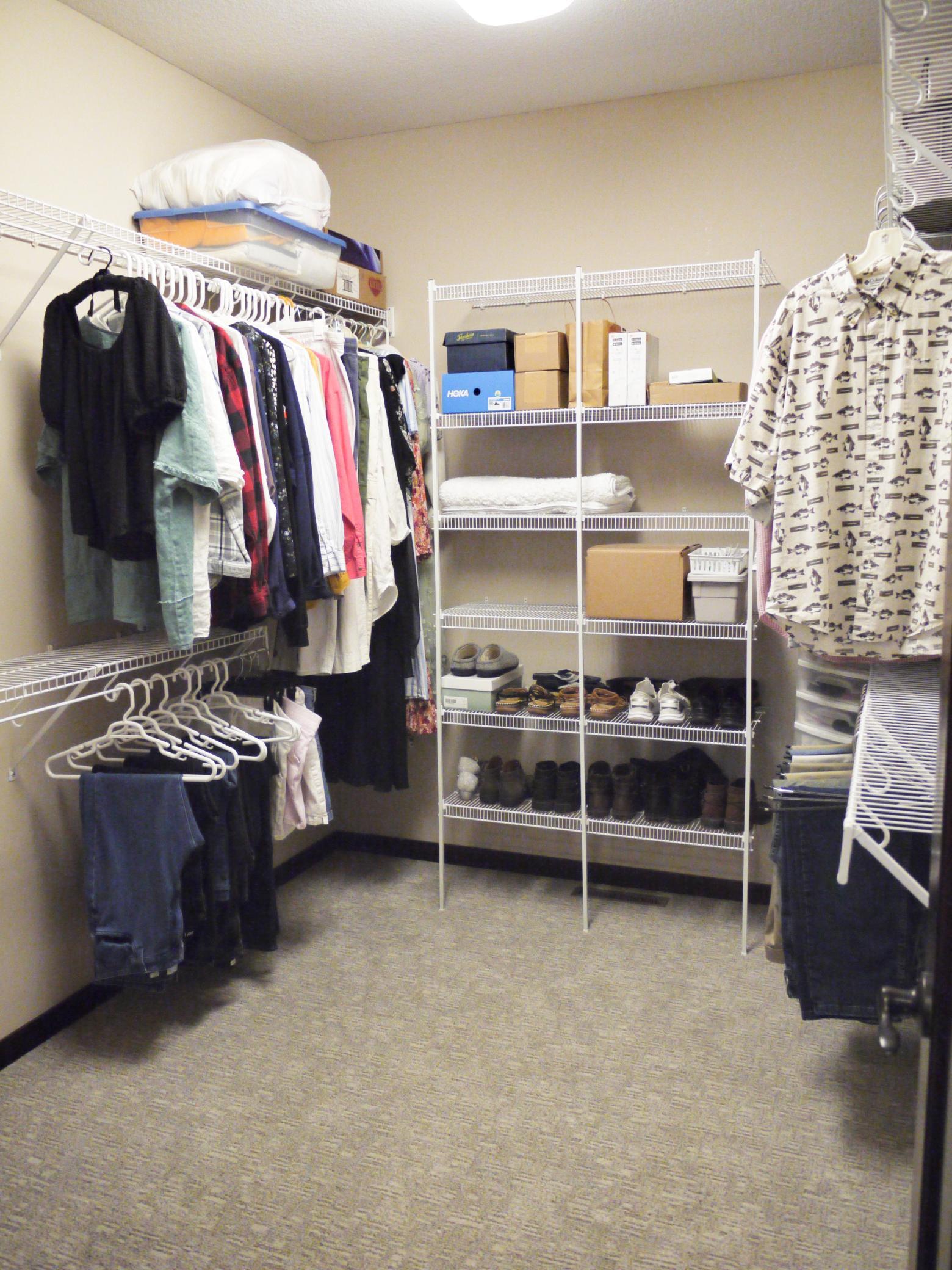 Walk-in closet off in-suite bath with ample storage space.jpg