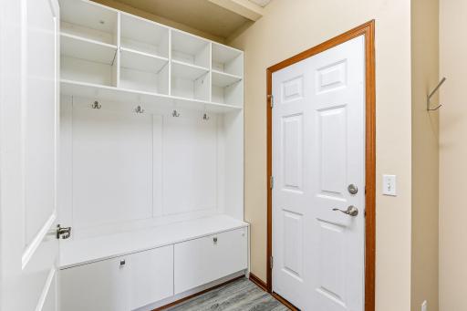 Laundry room with built-in shelving and ample storage space-18849-64th-Ave-40.jpg
