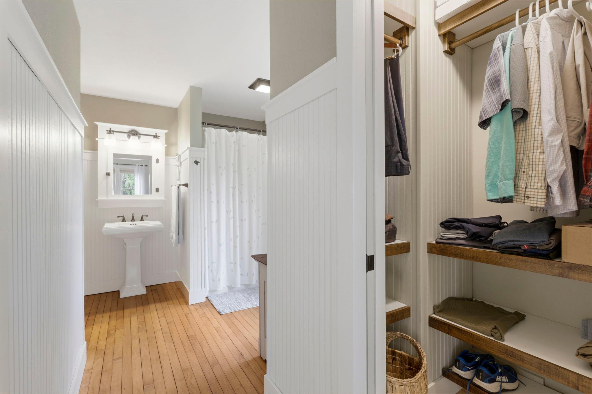 Thoughtfully designed storage and dressing space with beadboard accents