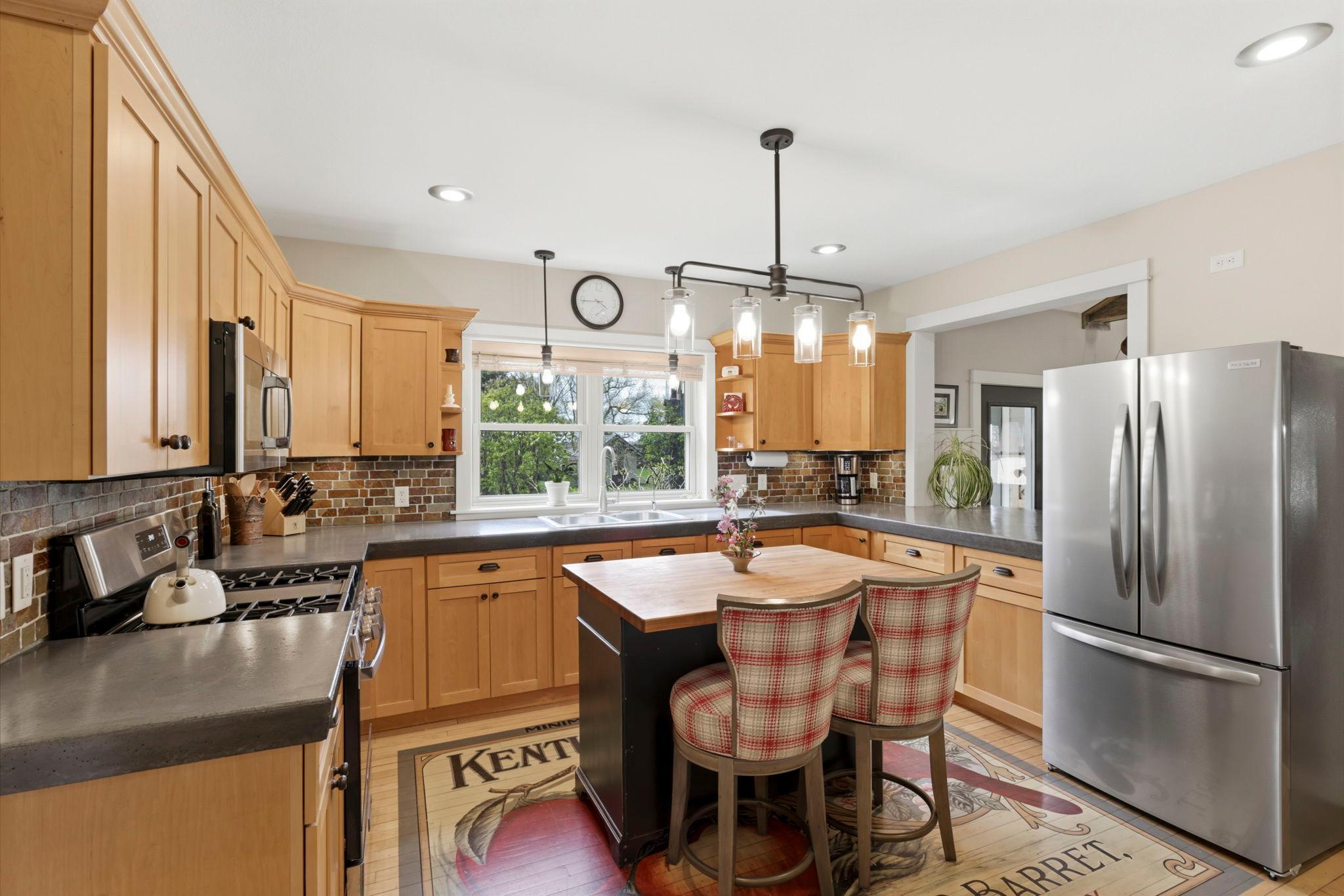 Spacious kitchen featuring ample cabinetry, stainless steel appliances, and a functional center island