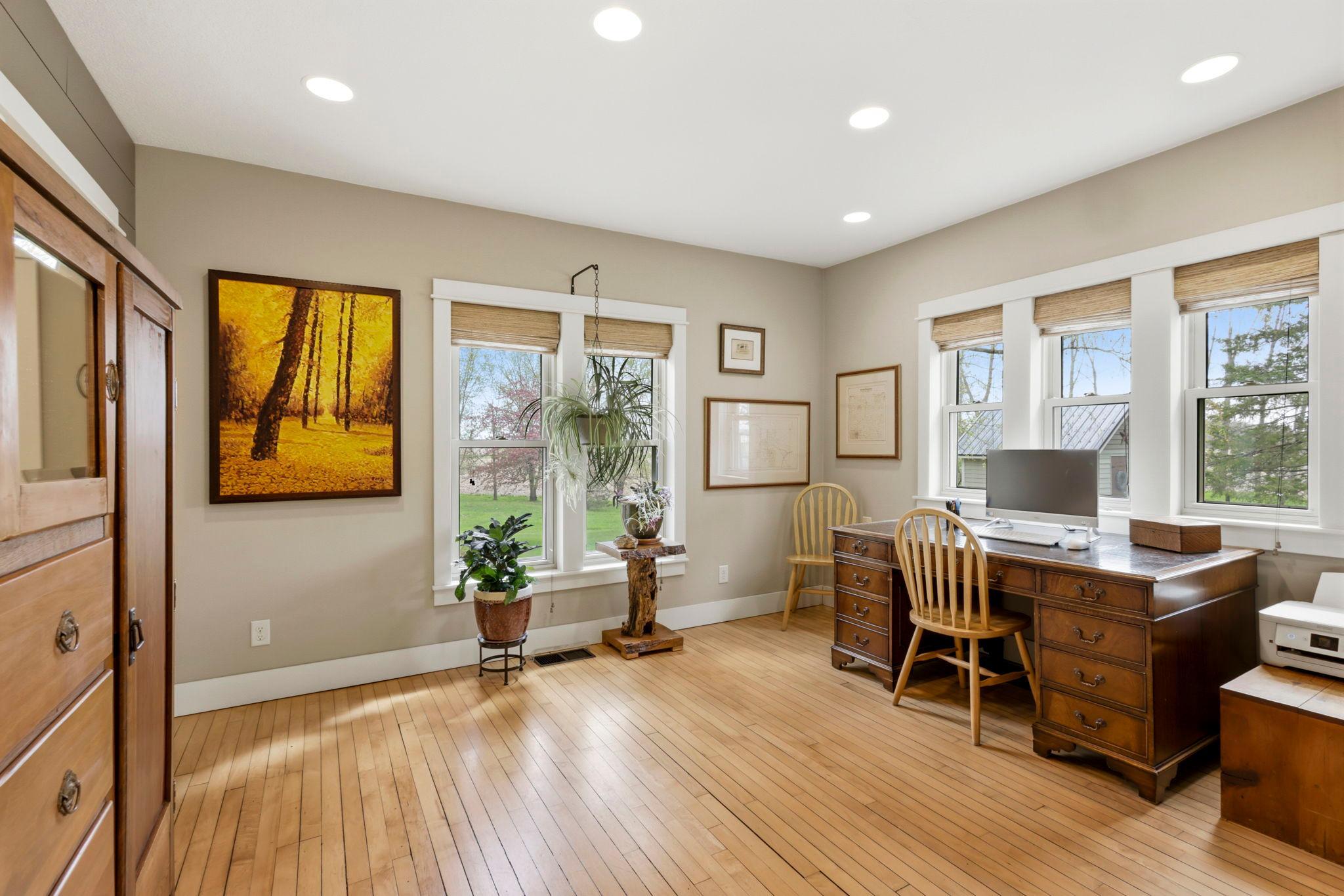 Flexible main-level office or sitting room with abundant natural light and peaceful country views.