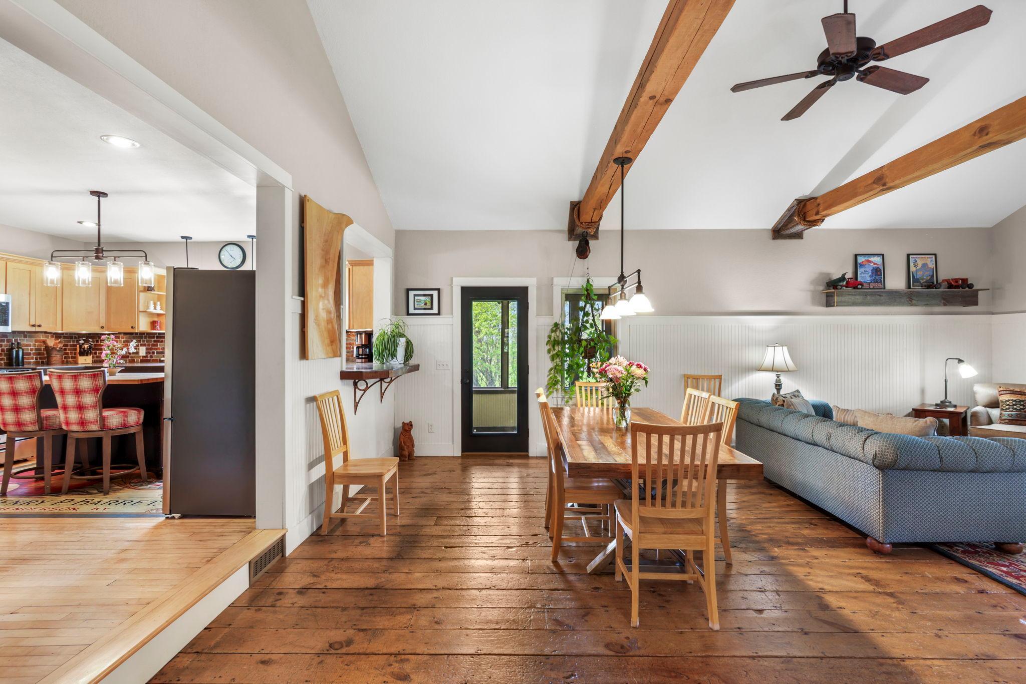 Dining area flows seamlessly into the kitchen and living spaces, creating an ideal layout for entertaining