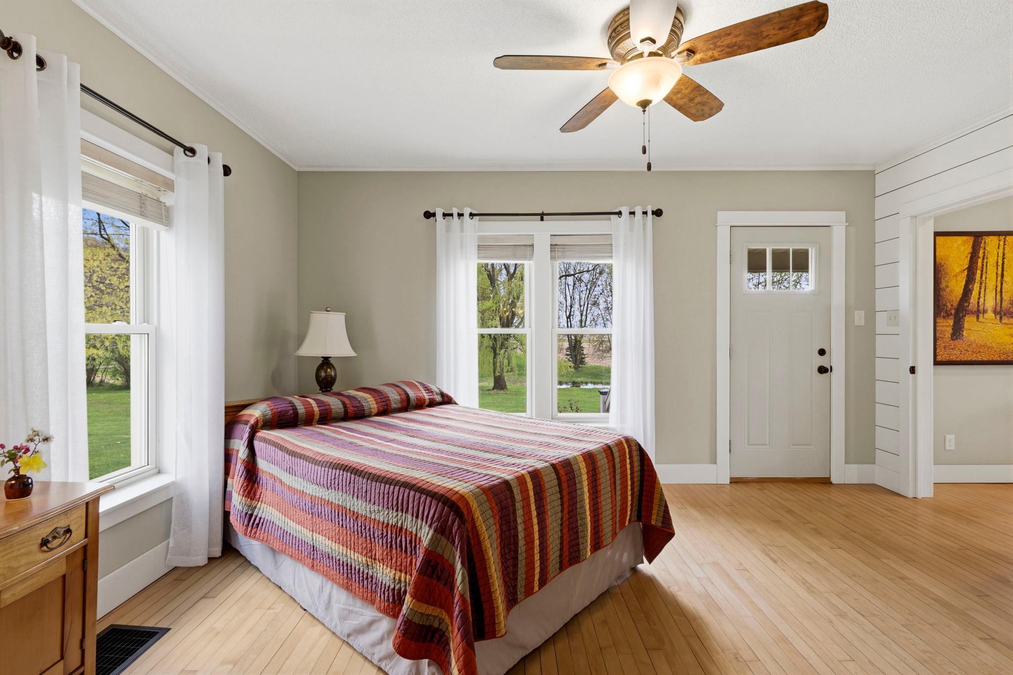 Spacious primary suite with private exterior access and calming neutral finishes.