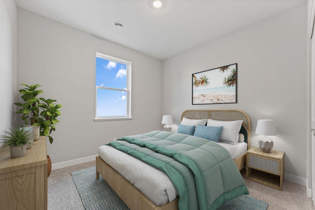 The second bedroom - could also function as an office or craft room! Virtually staged photo, color and finish will vary.