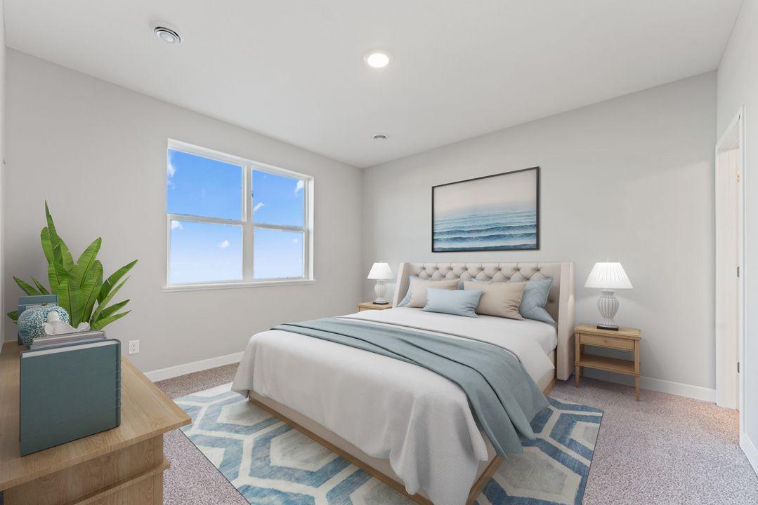 The primary bedroom overlooks the backyard and easily accommodates a great bedroom set! Virtually staged photo, color and finish will vary.