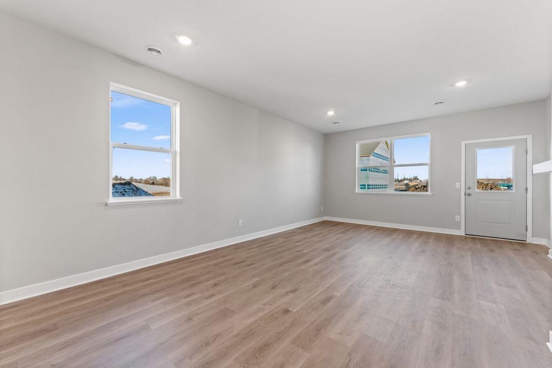 Natural light fills the living spaces of this home. Spec home. Actual home is under construction - color and finish will vary.