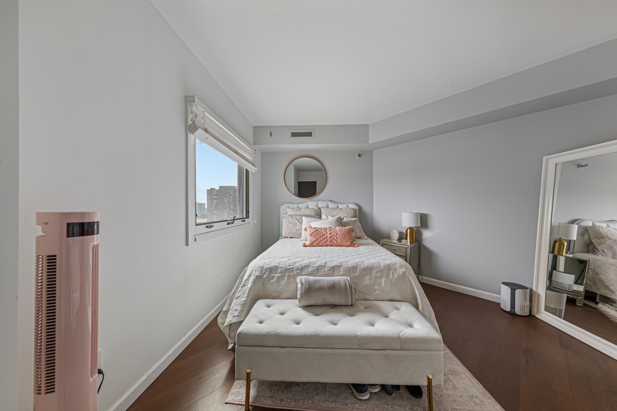 Spacious bedroom with city views
