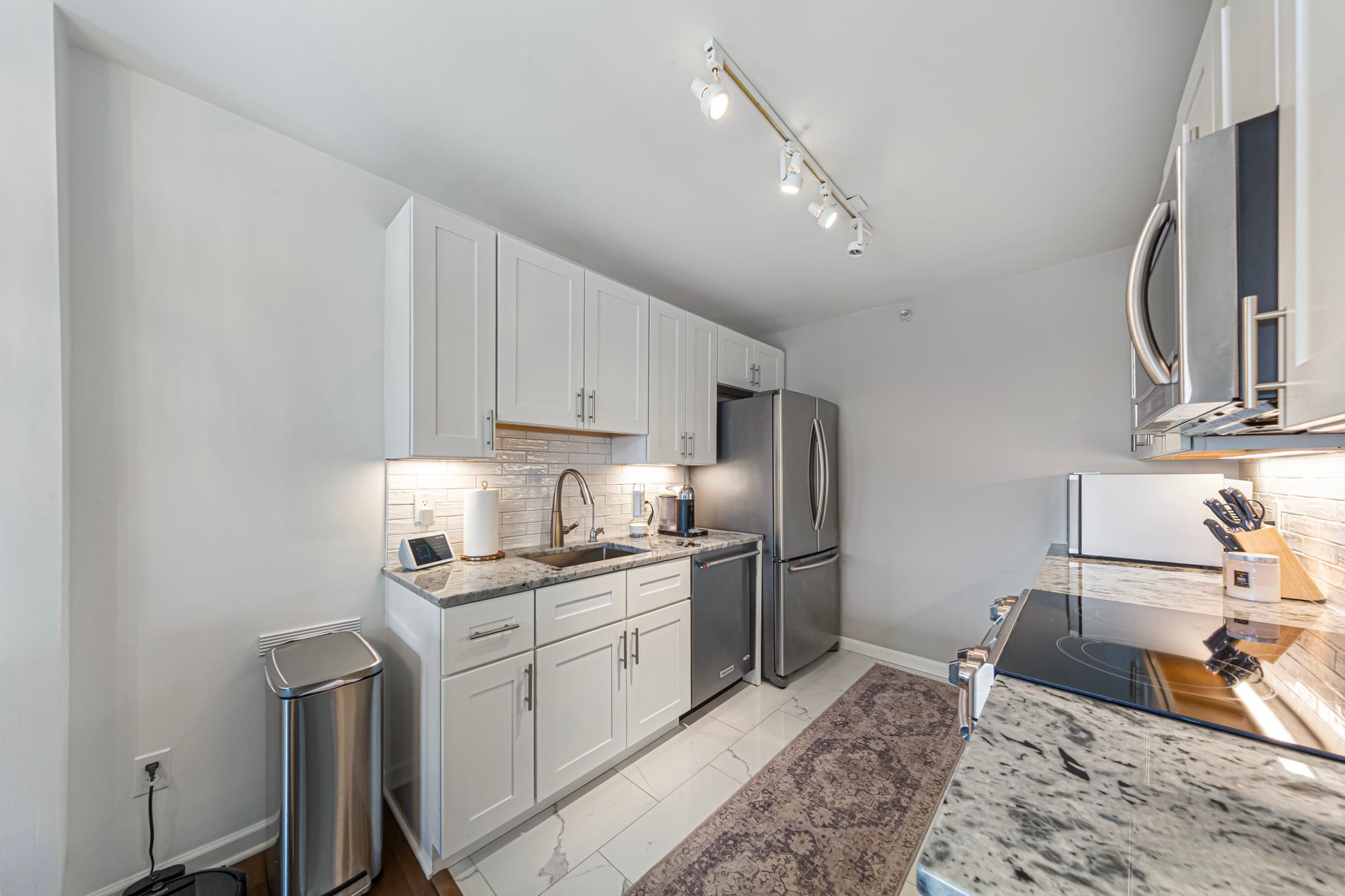 Beautiful tile floors, updated backsplash, stainless appliances