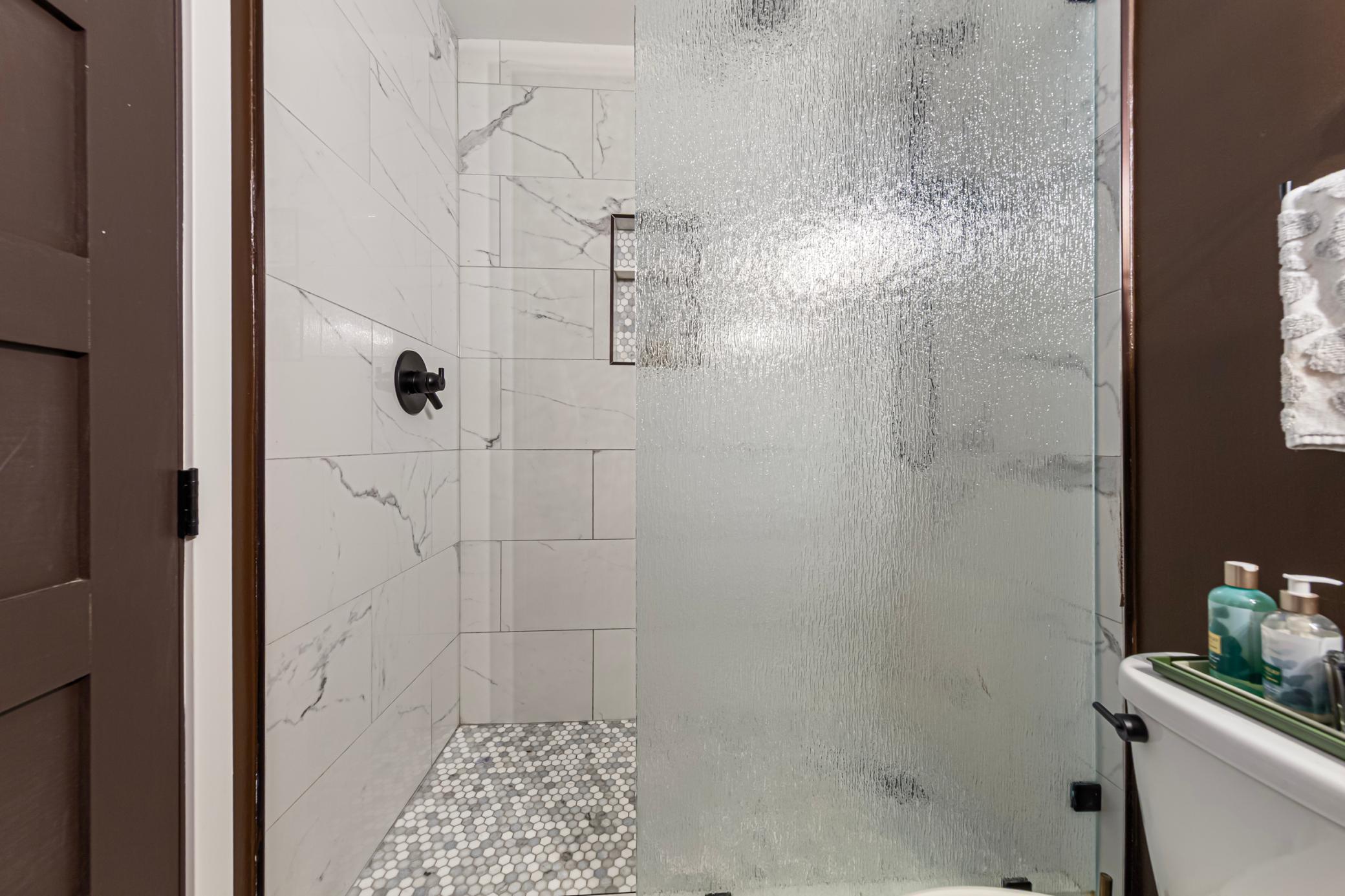 Spa-like walk in shower with custom tile