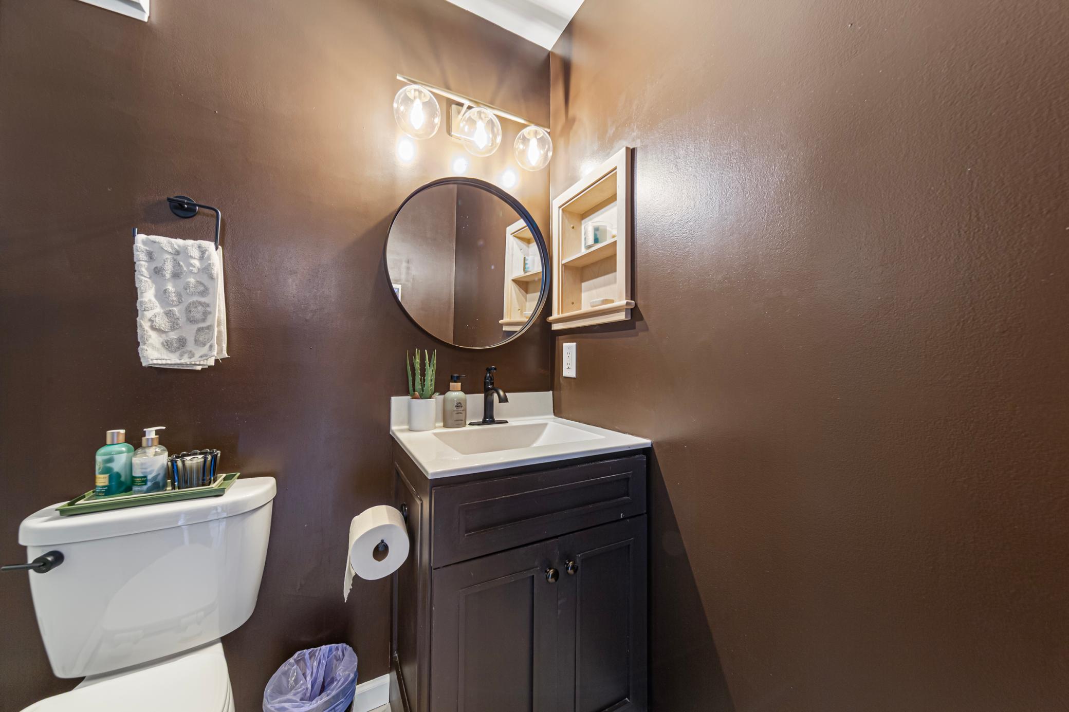Recently renovated bathroom with upgraded lighting and fixtures
