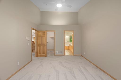 Private primary suite with walk-in closet and easy access to the full en suite bath.