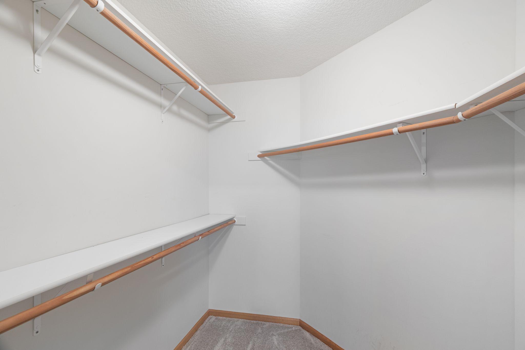 Generous walk-in closet with abundant storage and organization space.