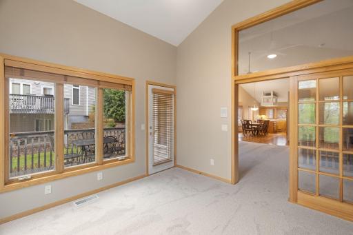 Bright sunroom retreat offering beautiful nature views and a relaxing space to unwind year-round.