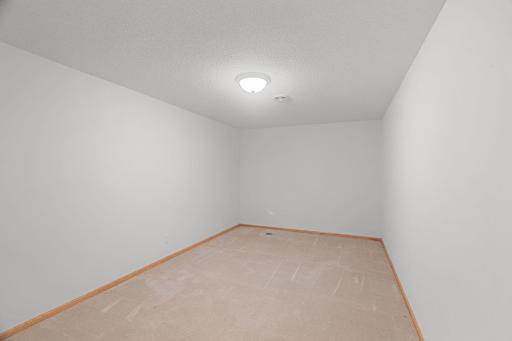 Flexible lower-level bonus room perfect for a hobby room, office, workout room, or guest space.
