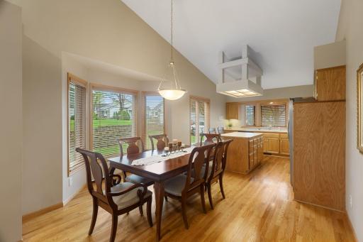 Informal dining area surrounded by windows, creating the perfect space for everyday meals or entertaining.