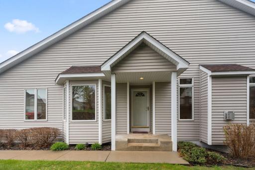 Welcoming covered front entry with charming curb appeal and low-maintenance exterior.