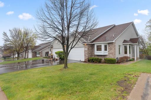 Beautiful end-unit townhome with a spacious 2-car attached garage and peaceful nature views all around.