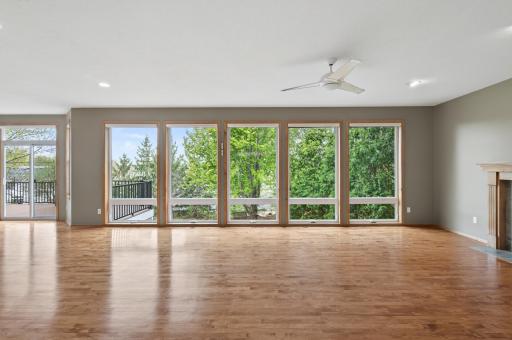 Living room windows overlooks the back yard