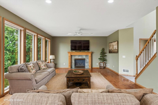Main level living room with hardwood floors and gas fireplace