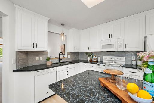 Refreshed kitchen includes stone counters, new cabinet fronts and hardware