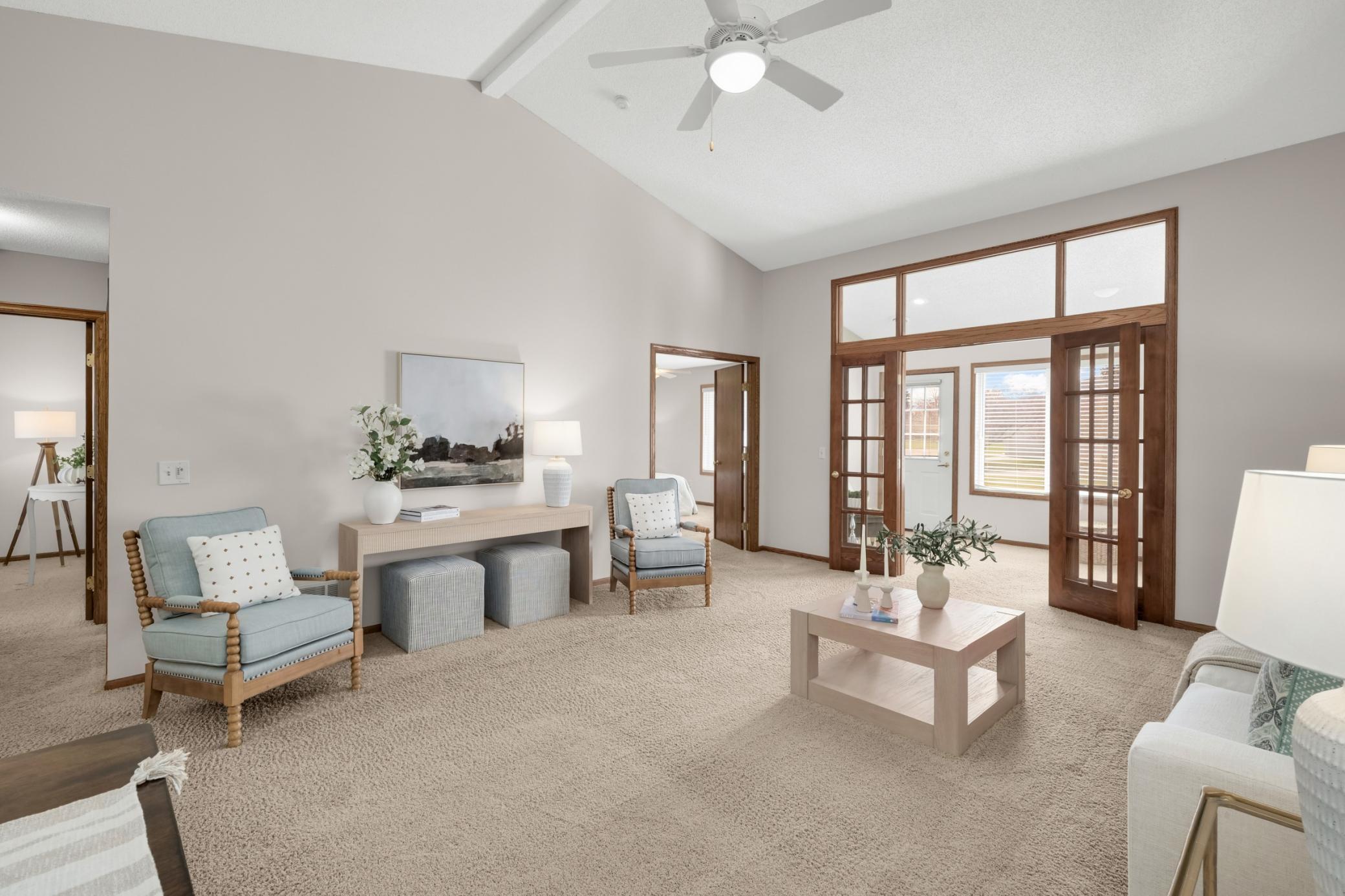 Vaulted ceilings and an open flow create a bright, inviting living room perfect for relaxing or entertaining.