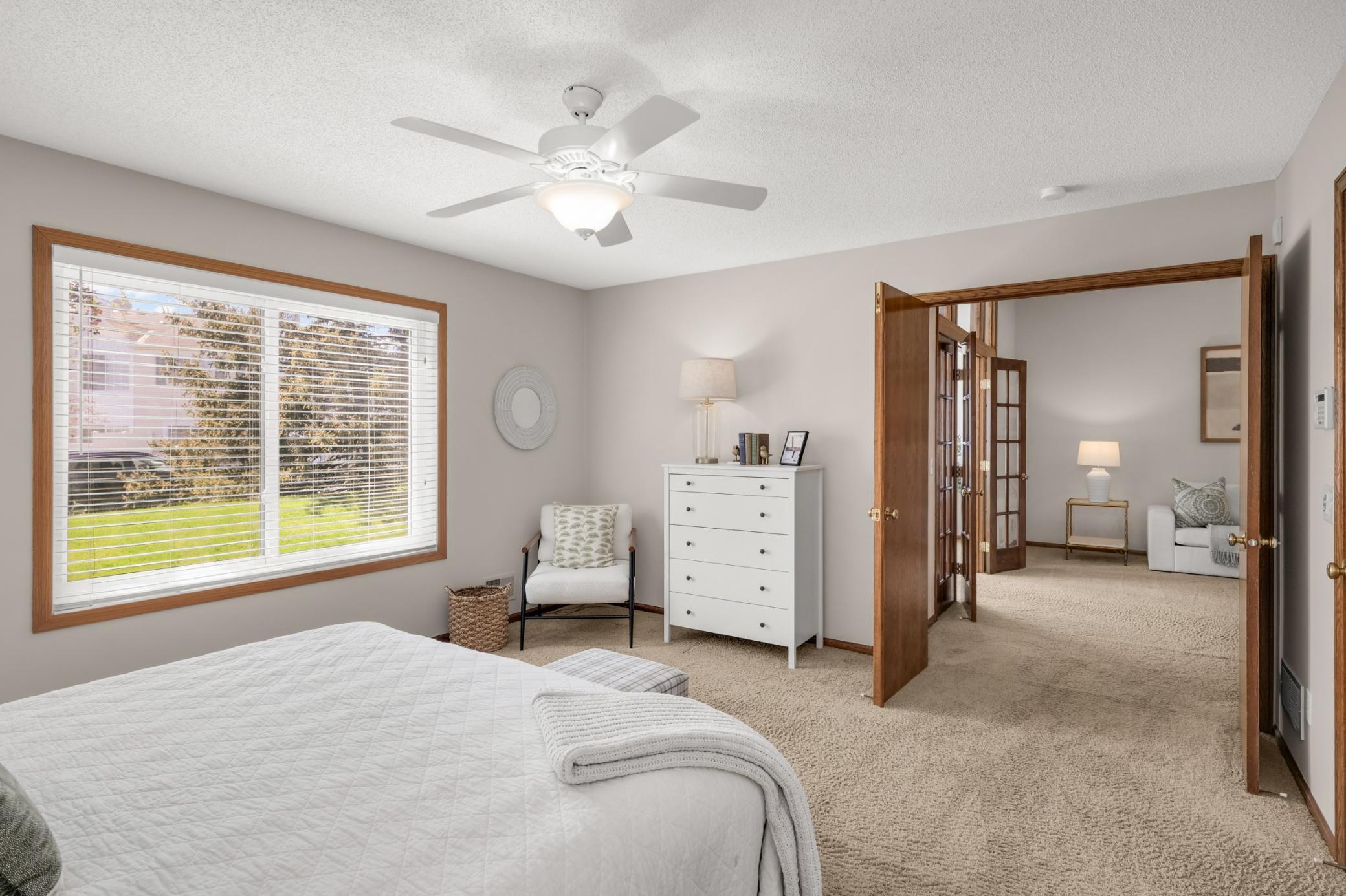 Large bedroom with stylish French doors