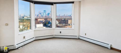 Photo for 1425 W 28th Street, 618, Minneapolis, MN 55408 - listing #7064583 Living Room Features Bay Window With Sweeping Views of Downtown....