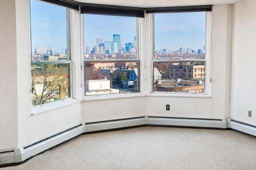 Living Room Features Bay Window With Sweeping Views of Downtown....