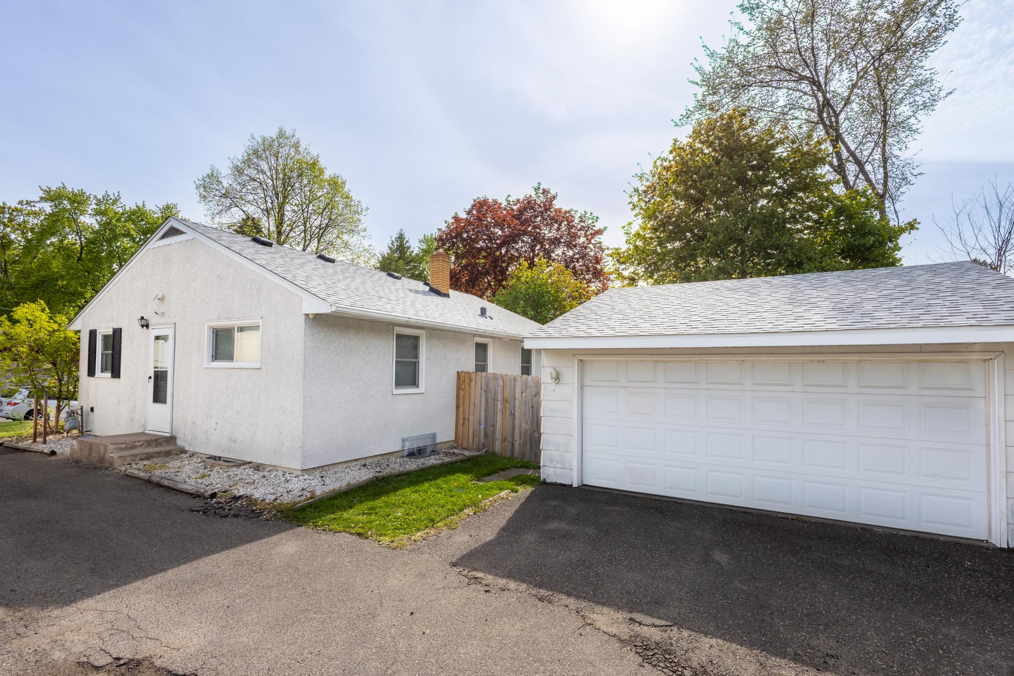 Exterior side of home and garage