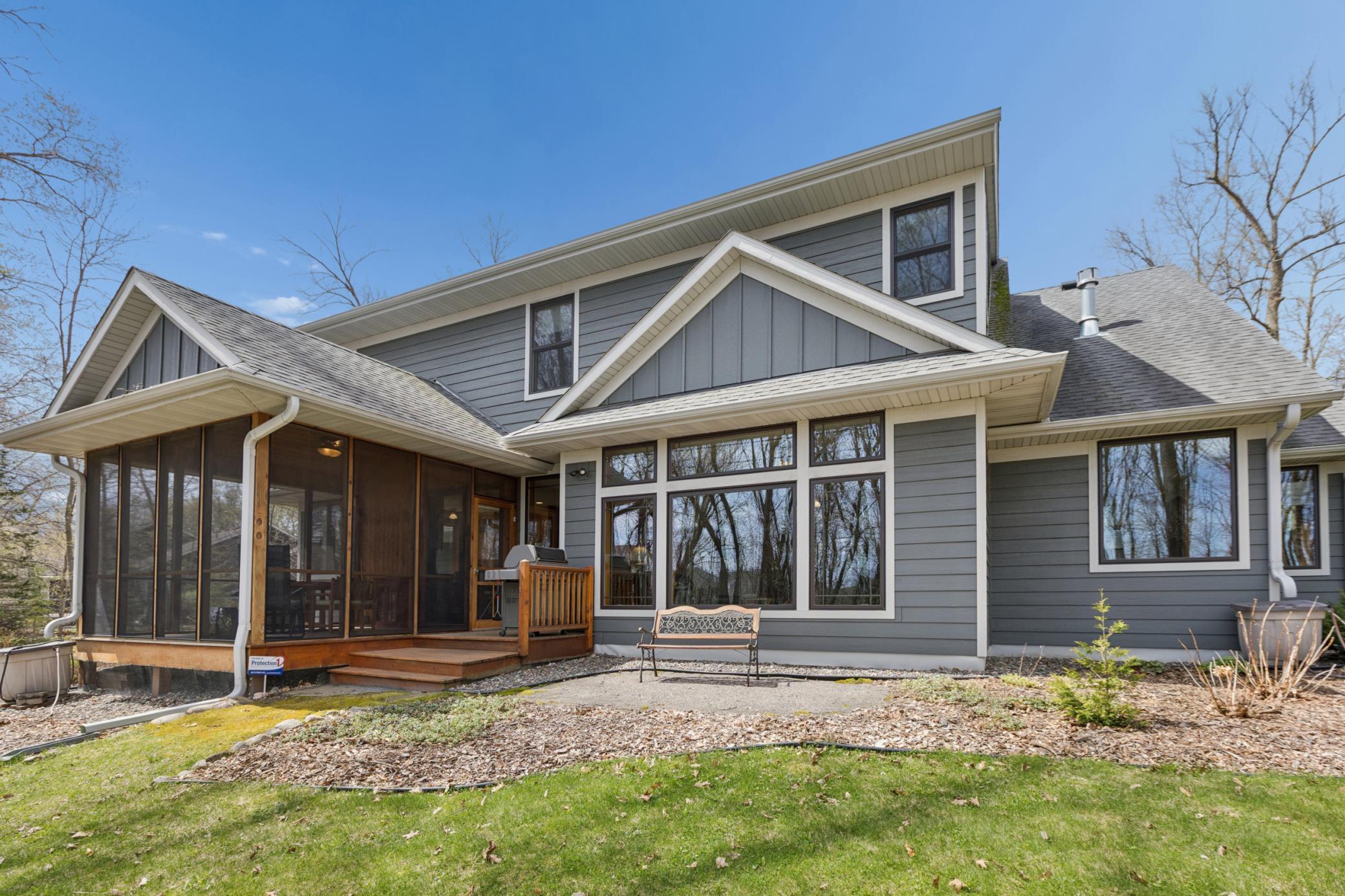 The back of the home is impressive. The screen porch is amazing! The perfect spot to enjoy nature and relax!