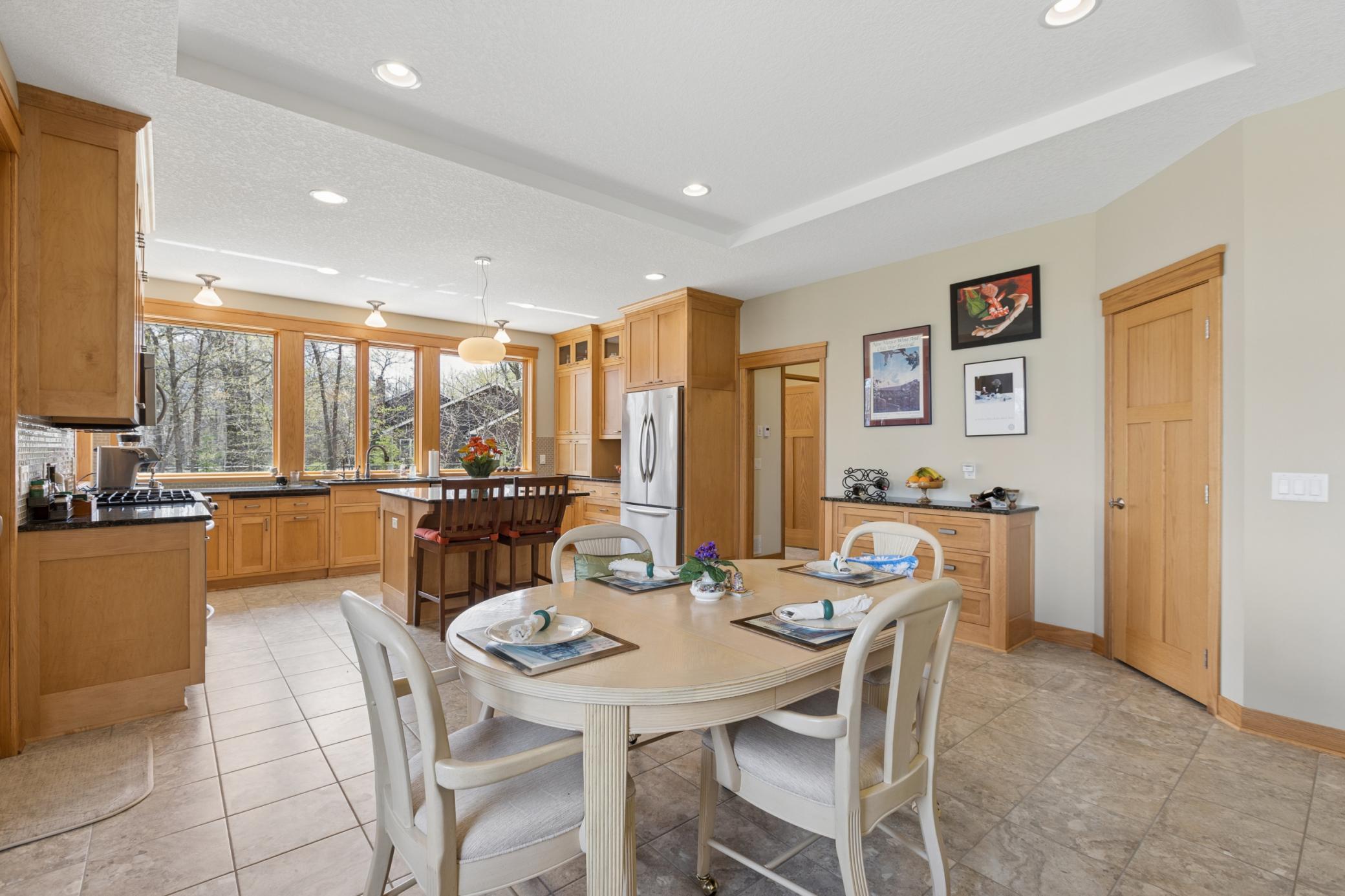 The dining room is perfectly appointed between the family room and kitchen. The walk in pantry is amazing!
