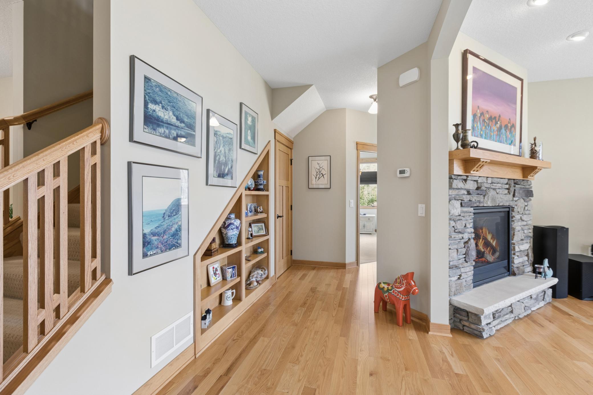 The hallway to the primary suite is impressive. Note the built in on the wall. How cool is that! Top quality finishes you won't see in many other homes!