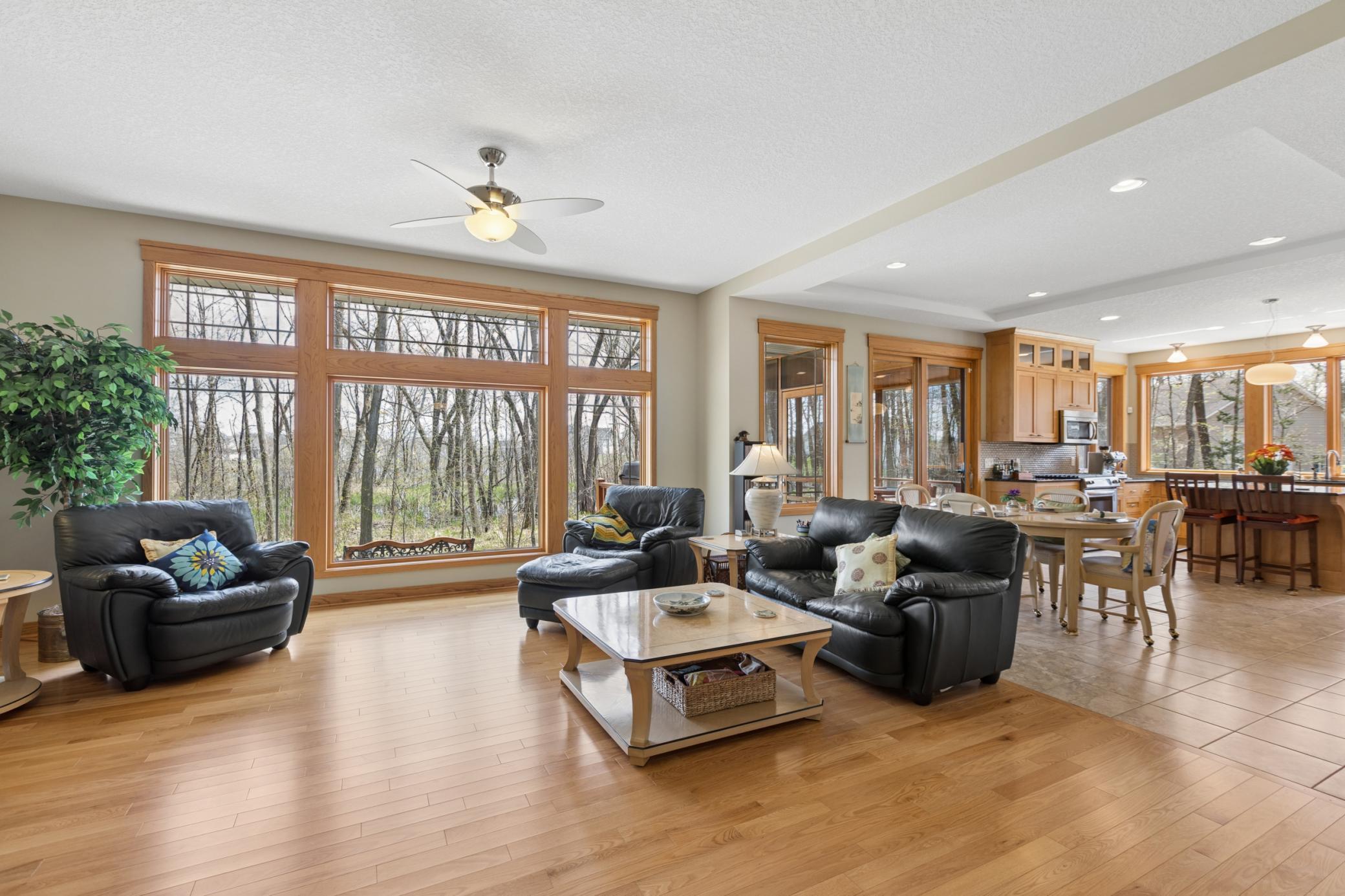 Another view of the main level family room. Open with high ceilings. Lovely flow to the dining room, screen porch and kitchen. The layout is perfect for entertaining!