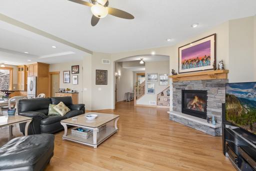 Another view of the main level family room. Love the fabulous cozy gas fireplace. Notice the cool arch in the wall. Gorgeous oak hardwood floors. No detail has been missed here!