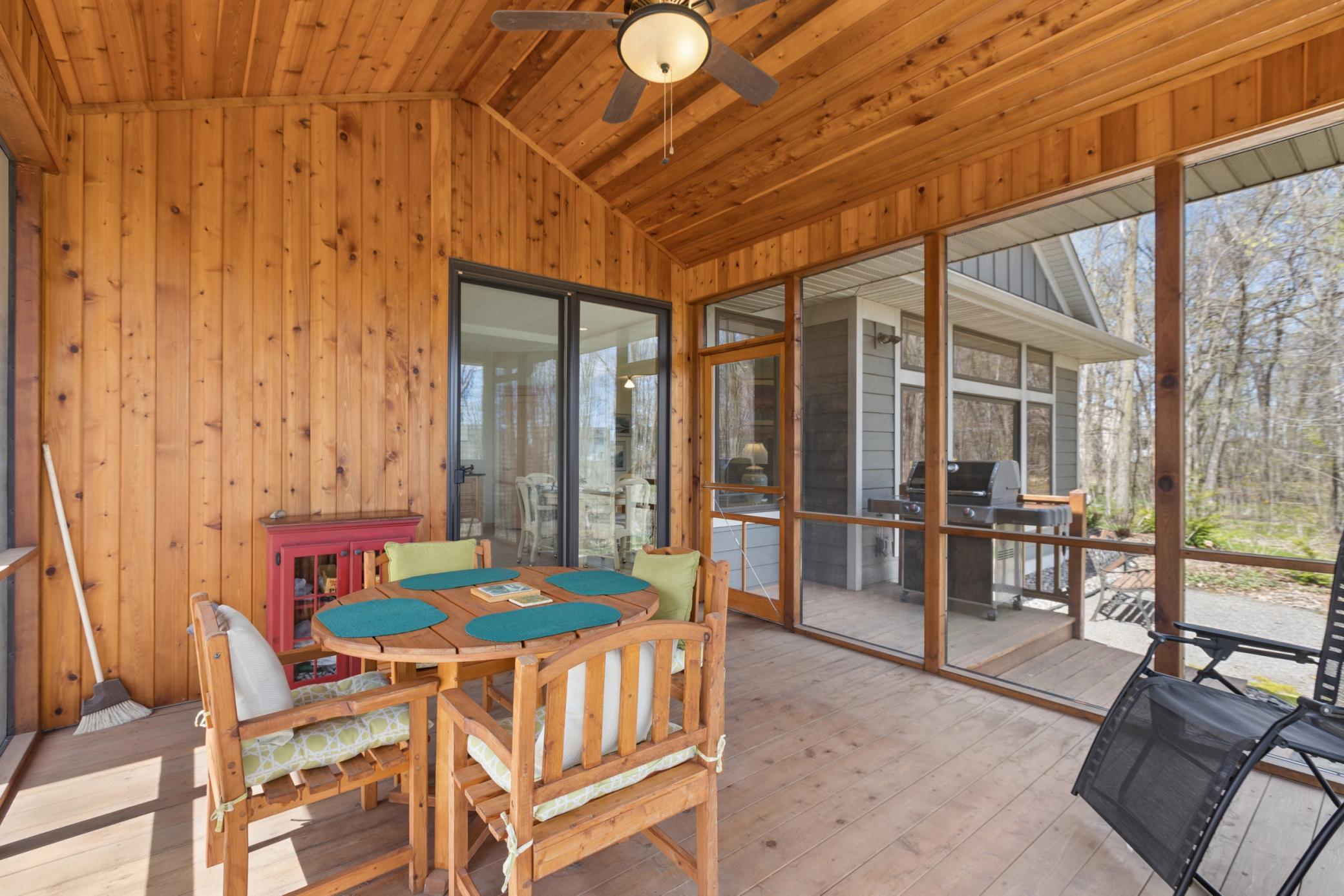 Another view of the spacious screen porch. Lovely details! Perfect!