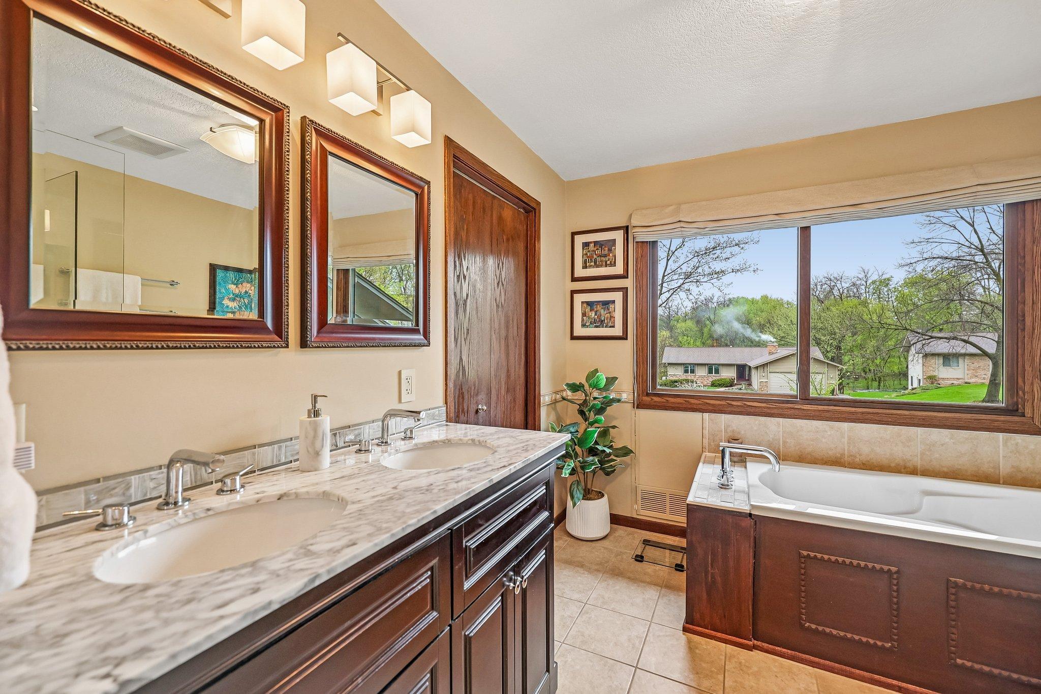 Ensuite Primary bathroom with double sinks...