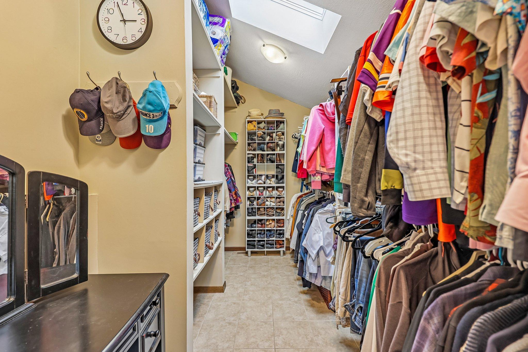 Spacious walk-in closet with sky lights!